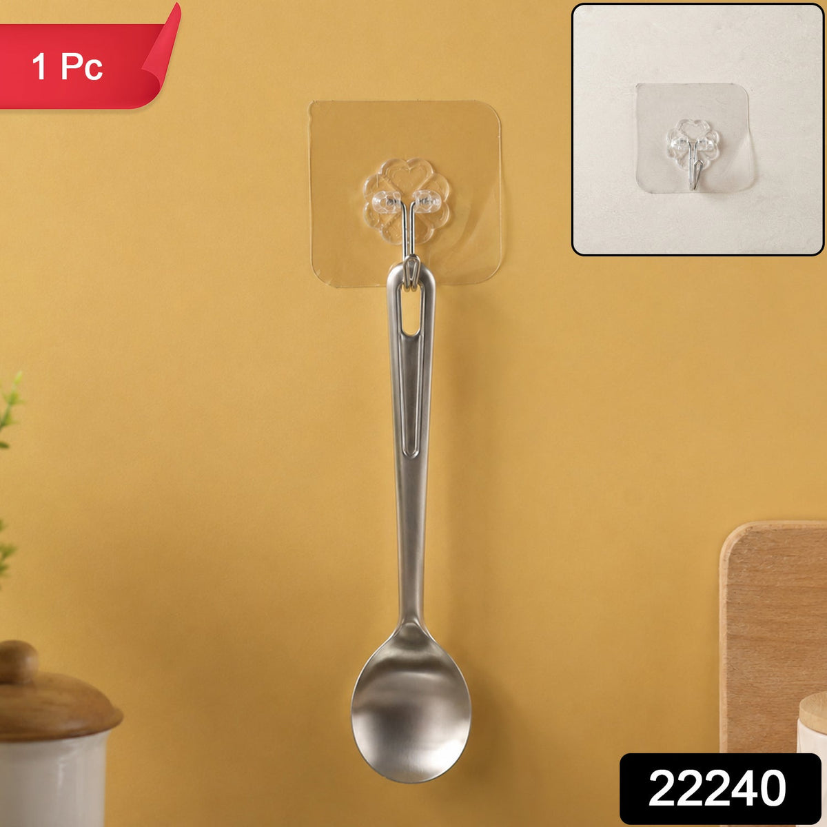 A silver spoon hanging from a transparent self-adhesive hook on a yellow wall, with a close-up inset and '1 Pc' and '22240'