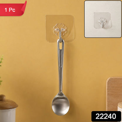 A silver spoon hanging from a transparent self-adhesive hook on a yellow wall, with a close-up inset and '1 Pc' and '22240'