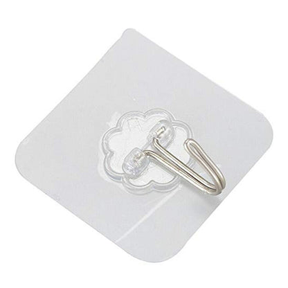 An angled, close-up view of a transparent self-adhesive hook with a silver metal hook on a white background.