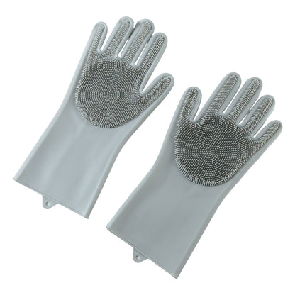 A pair of grey silicone scrubbing gloves with textured palms is angled on a white background.