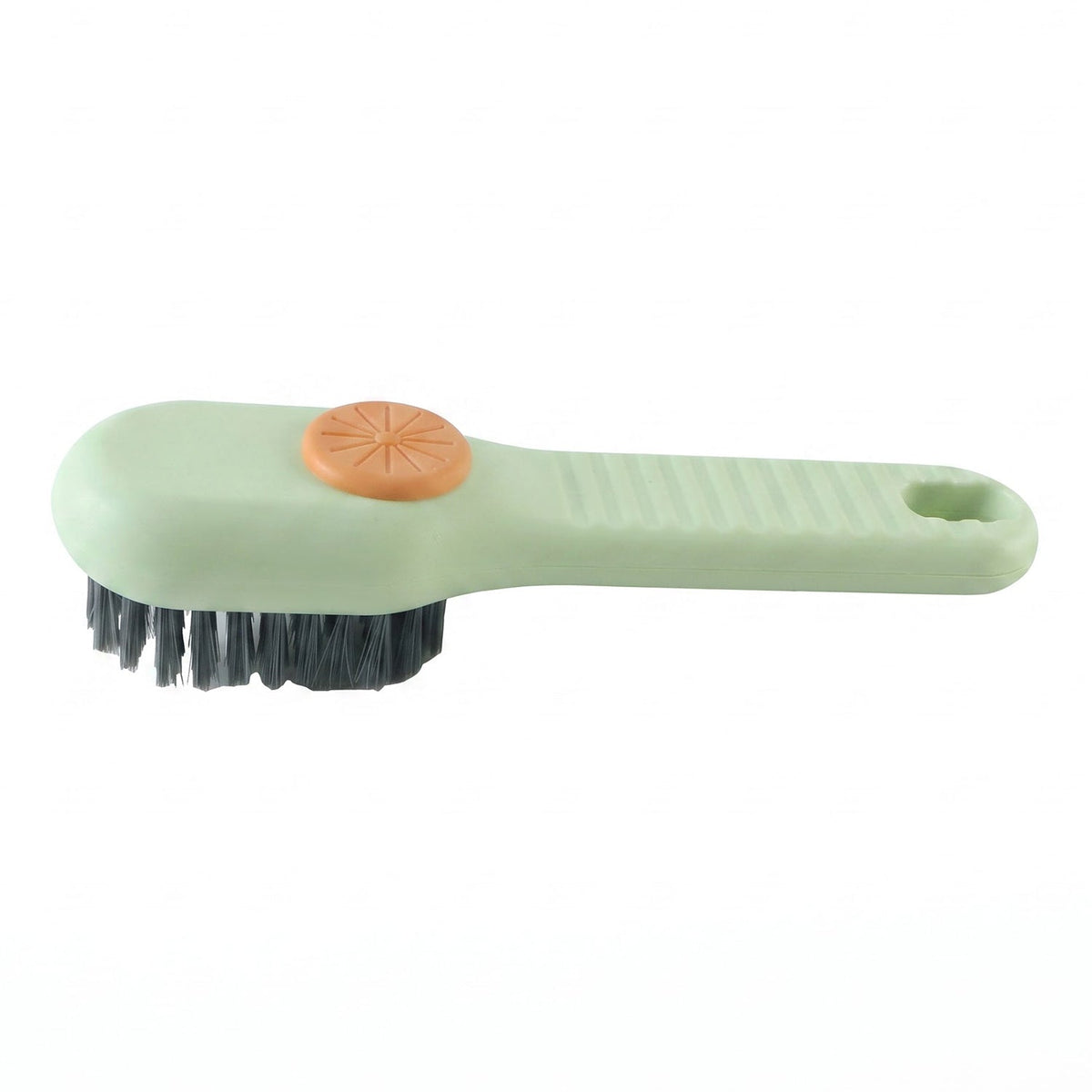 A light green and orange liquid-dispensing brush with dark bristles is shown on a plain white background.