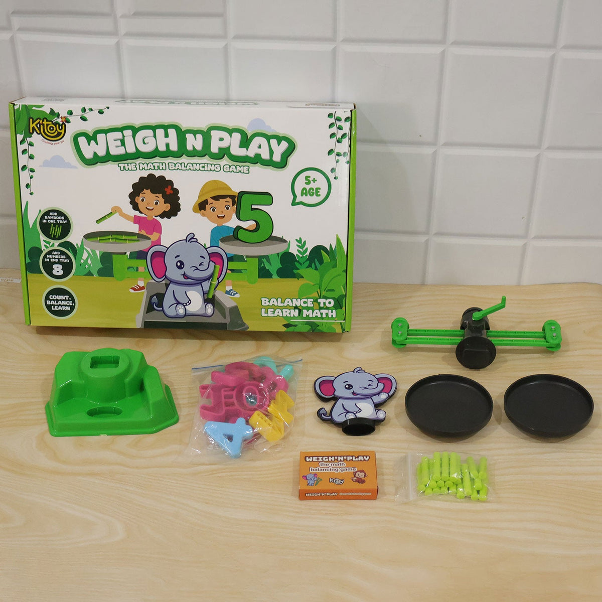Child engaged with elephant math balancing game for learning