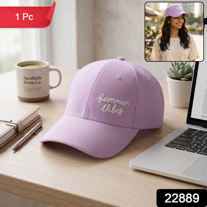 Lavender baseball cap with "Summer Vibes" embroidery on a desk, with a red "1 Pc" label and an inset of a woman wearing the