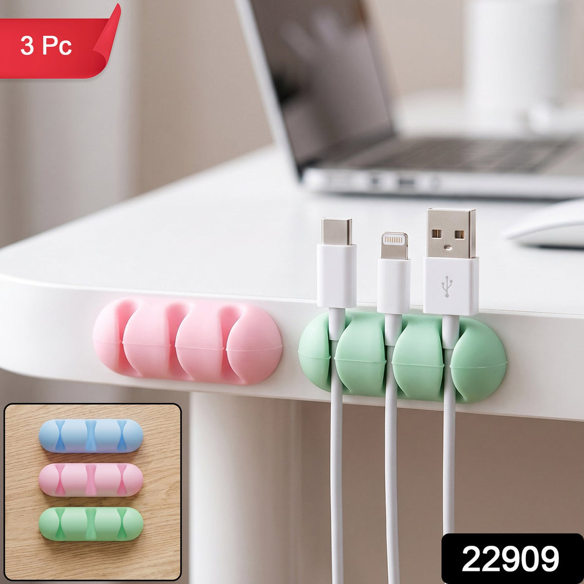 A pink and a green silicone cable organizer are attached to a white desk, holding three charging cables, with a '3 Pc' label