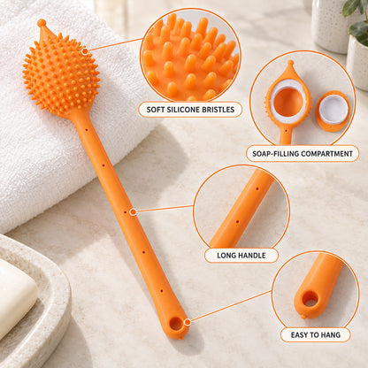 An orange silicone back scrubber with callouts highlighting its soft bristles, soap compartment, long handle, and hanging