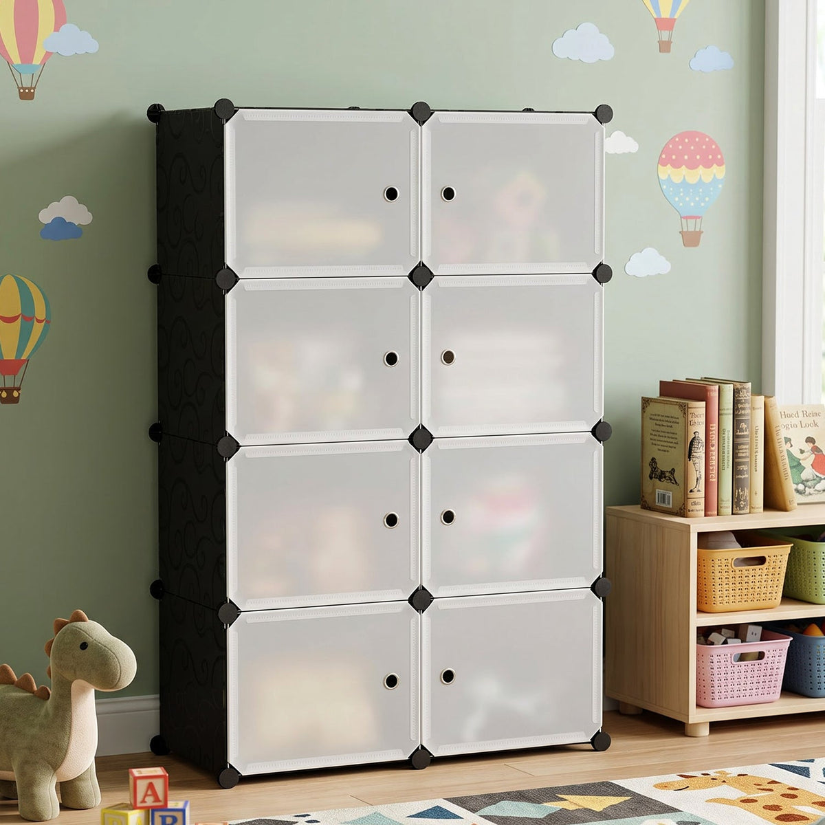 Black and white modular storage cabinet with frosted doors in a child's room with hot air balloon decals.