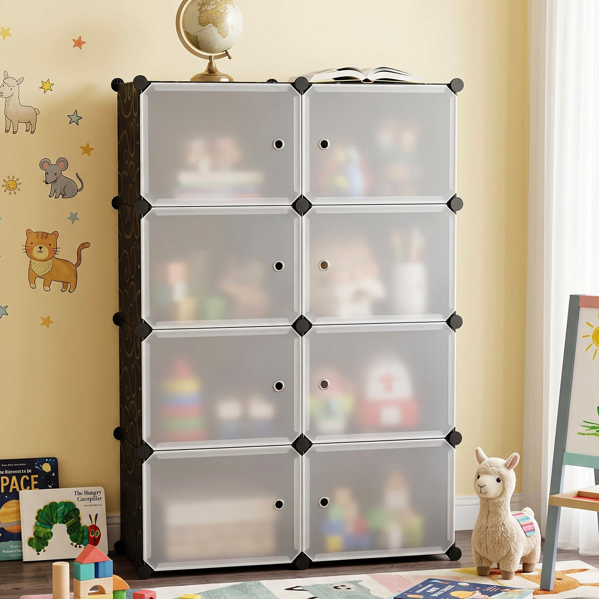 Black and white modular storage cabinet with frosted doors in a child's room with animal wall decals.