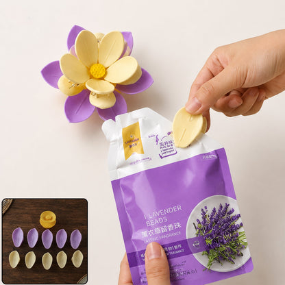 A hand inserting a yellow petal into a purple and yellow flower clip, next to a lavender bead pouch,