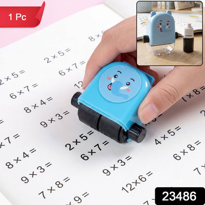 A hand holds a blue elephant-shaped math roller stamp, printing multiplication problems on a white notebook. A – view 2