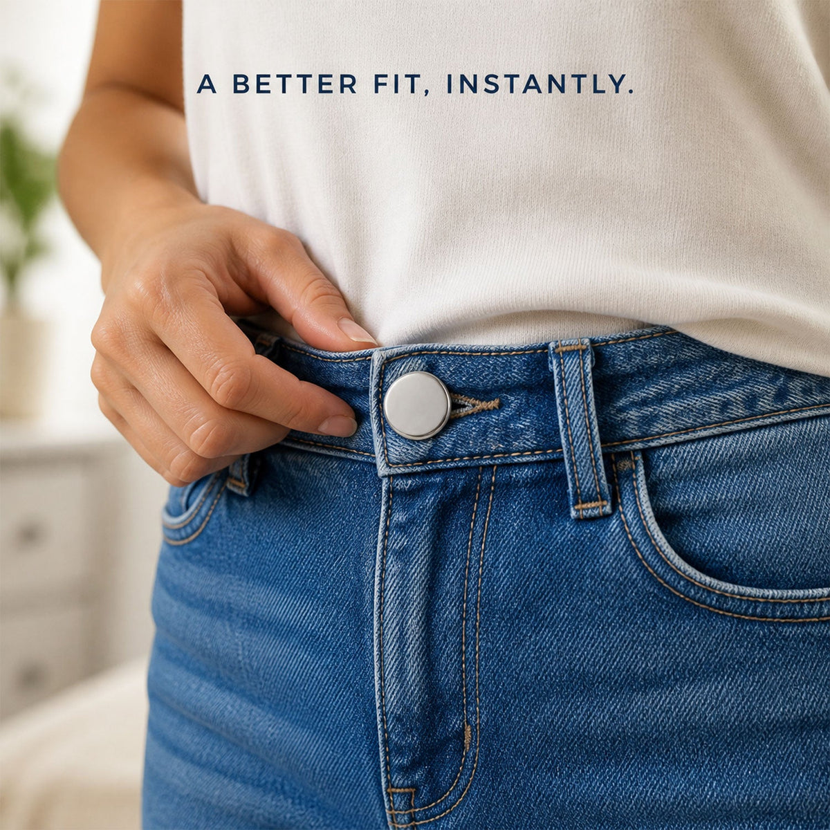 A person's hand adjusting a silver metal button pin on the waistband of blue jeans, with text overlay.