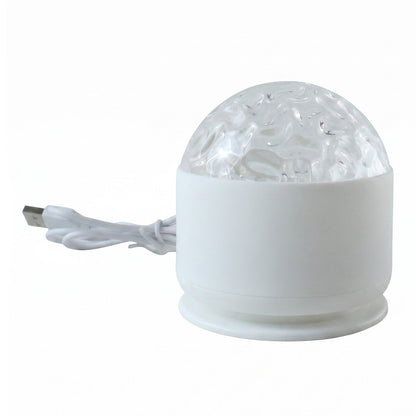 A white LED projection light with a clear textured dome and a white USB cable on a white background.