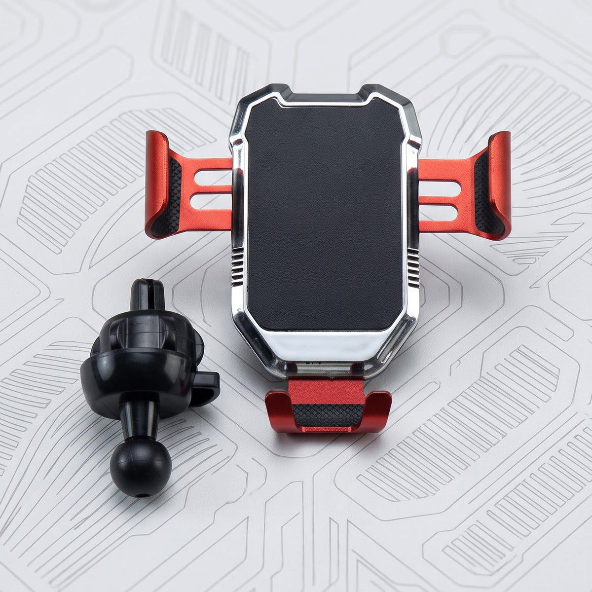A red and silver car phone holder with a black textured grip, alongside its black ball joint attachment.