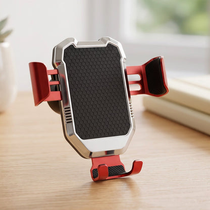 A red and silver car phone holder with a black textured grip stands upright on a light wooden surface.