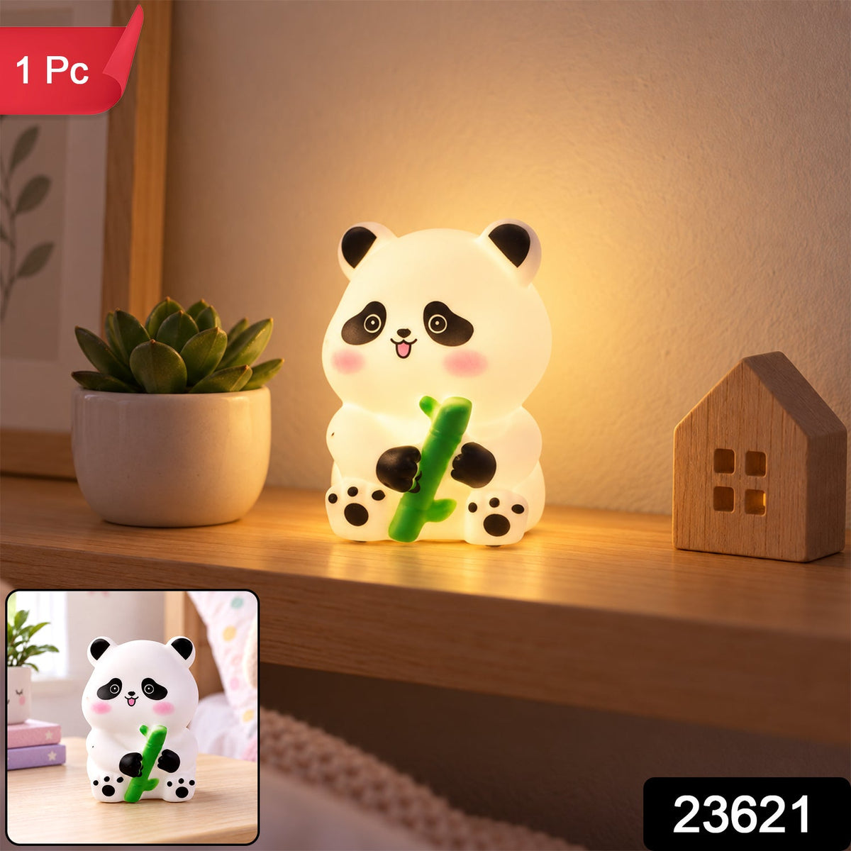 Illuminated panda night light with a green bamboo stalk, sitting on a wooden shelf beside a succulent and a miniature house.