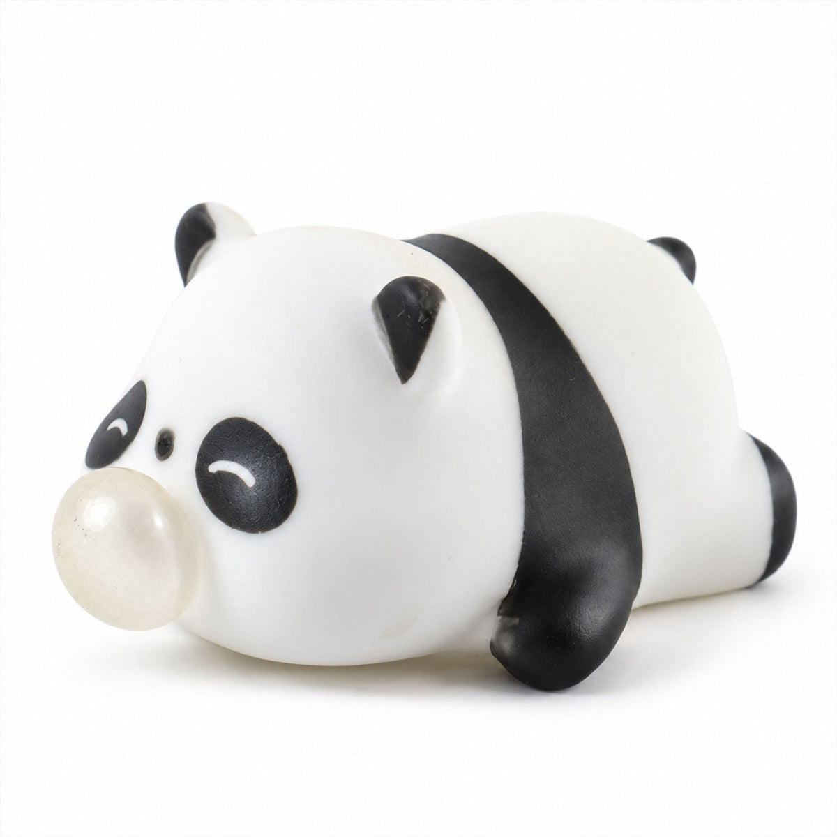 The white and black panda squishy toy, with a clear bubble, rests on a clean white surface.