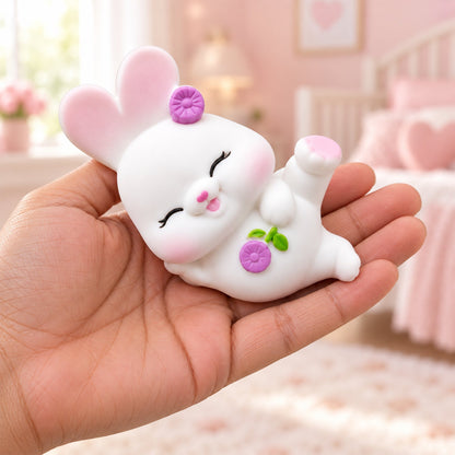 Cute reclining rabbit night light on a white background