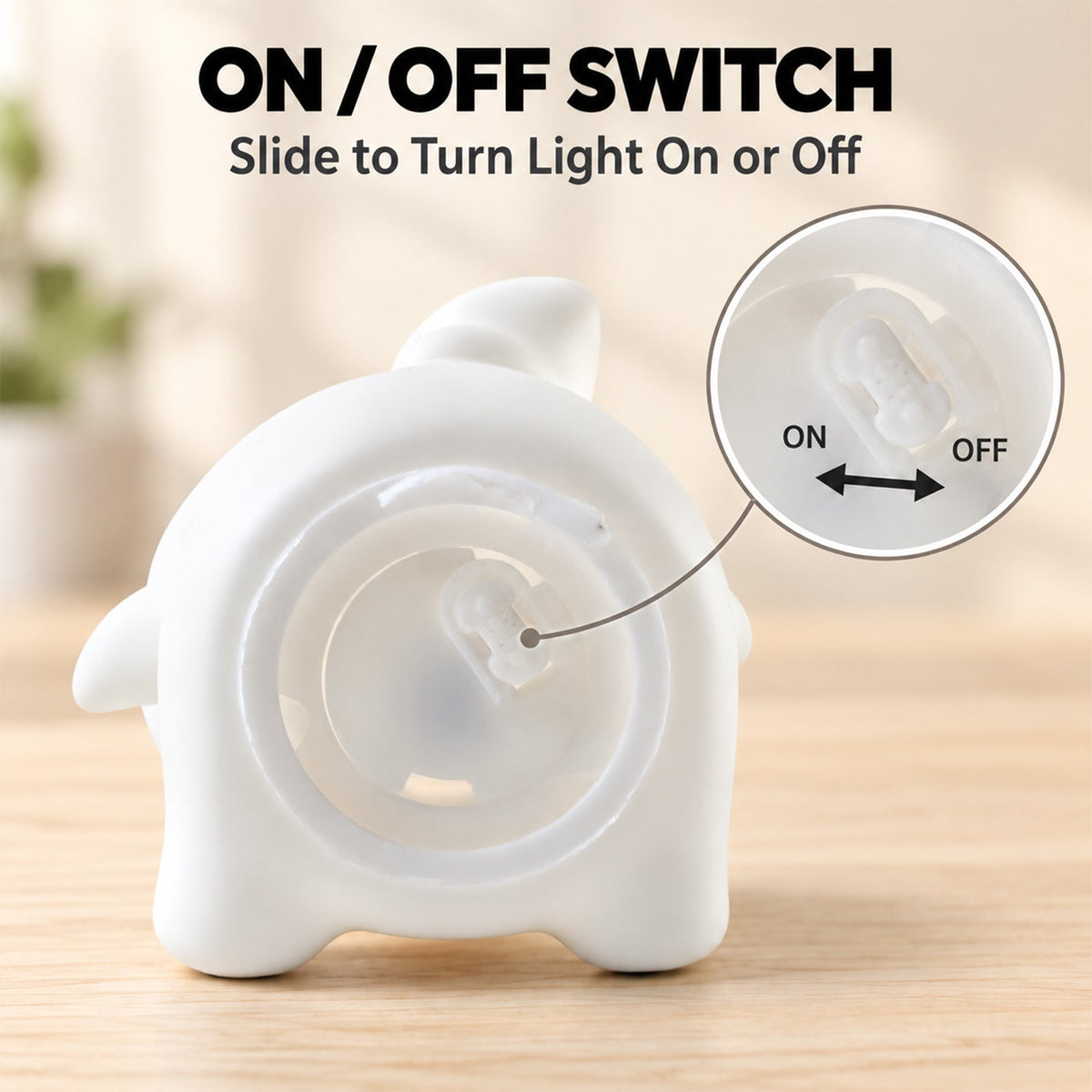 The back of the white panda night light showing a circular opening with a visible on/off slide switch.