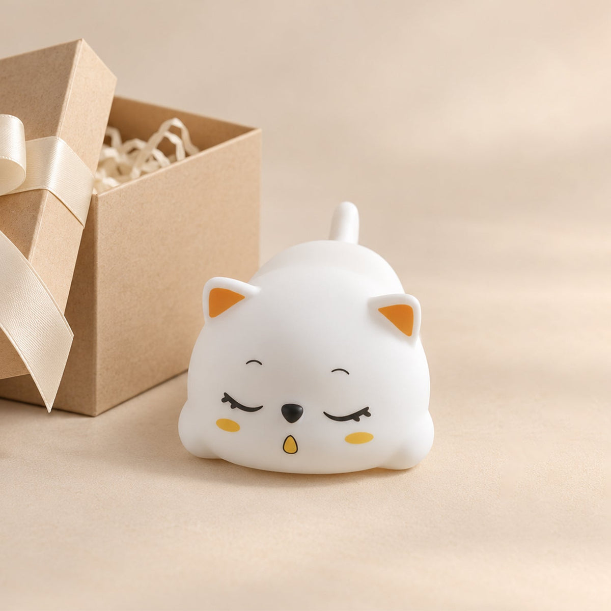 Sleeping cat night light on a white background