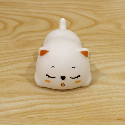 Sleeping cat night light used in a bedroom setting