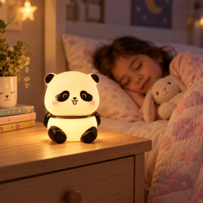 A glowing panda night light sits on a wooden bedside table while a child sleeps peacefully in the background.