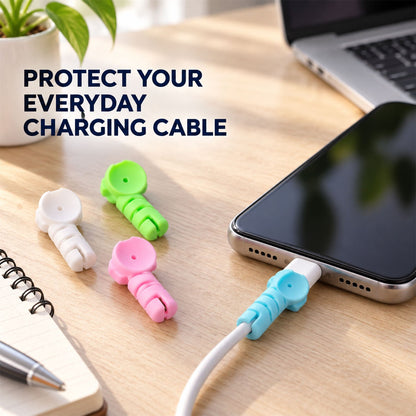 Three cable protectors on a desk, with a blue one attached to a phone charging cable, protecting it from bending.