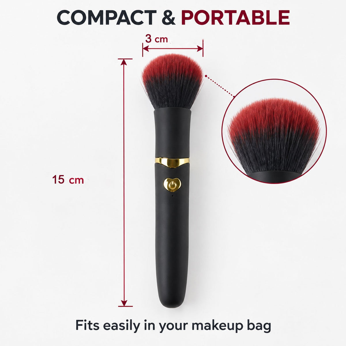 A black and red makeup brush with gold accents stands on a vanity table with blurred perfumes and a mirror in the background.