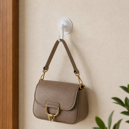 Multipurpose suction wall hook in use