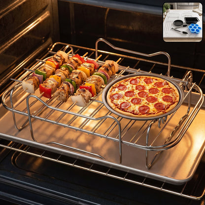 A metal air fryer rack holds chicken and vegetable skewers, plus a small pepperoni pizza, inside an oven. The top right