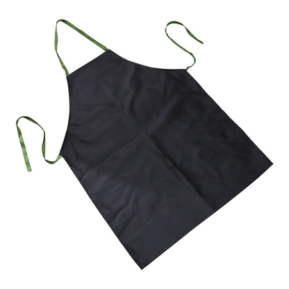 A black apron with green ties is angled on a white background.