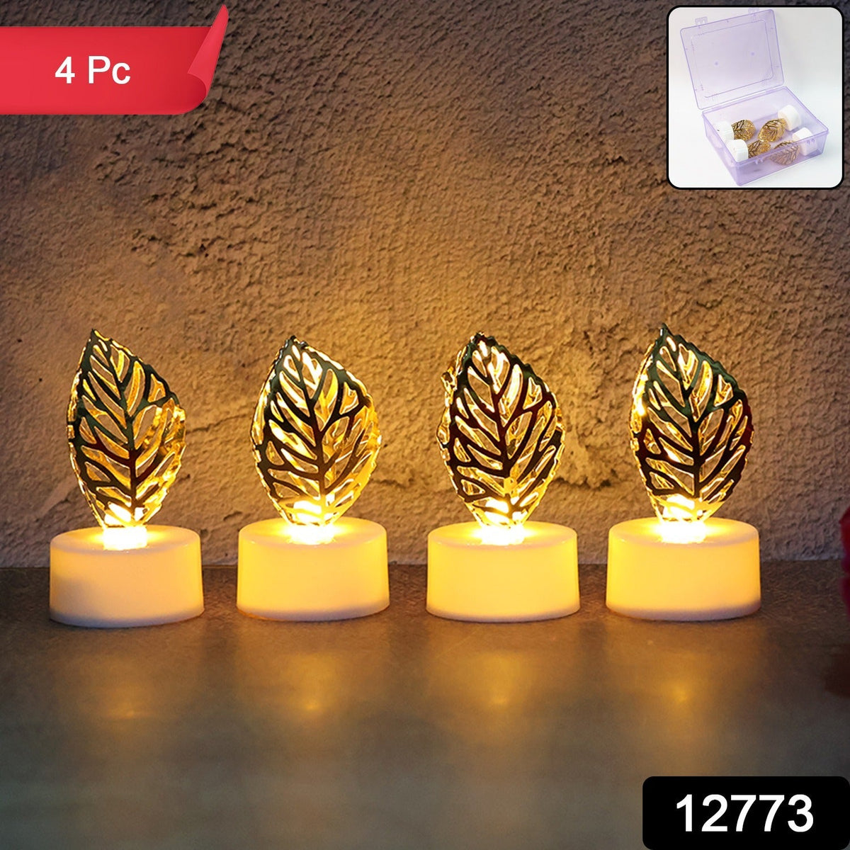 Four golden leaf LED candles in a row against a textured wall, with a small box of beads in the corner.
