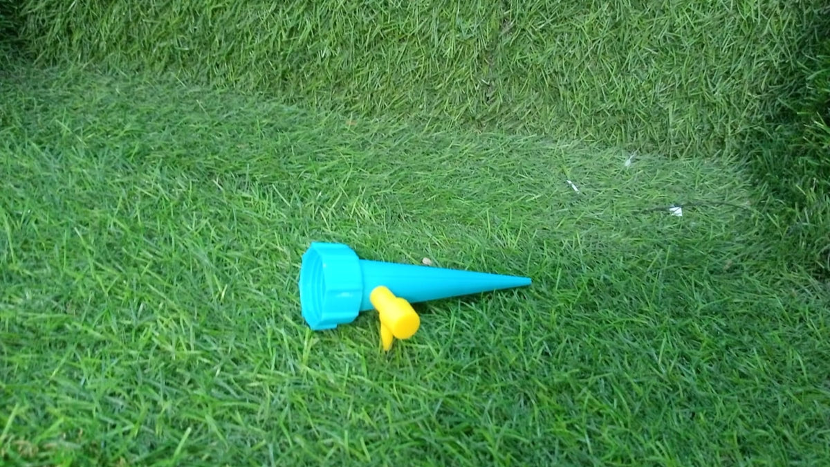 Detailed components of the plant watering spike, including the ceramic tip and valve.
