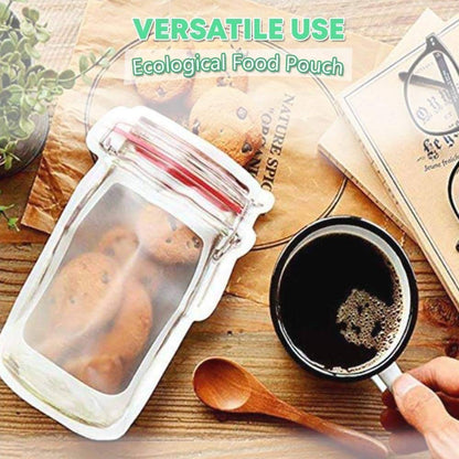 A red-lidded jar-shaped pouch filled with cookies, next to a cup of coffee and a wooden spoon.
