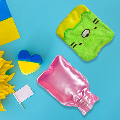 A green and yellow kitty hot water bag, pink hot water bottle, and Ukrainian flag items on a blue background.