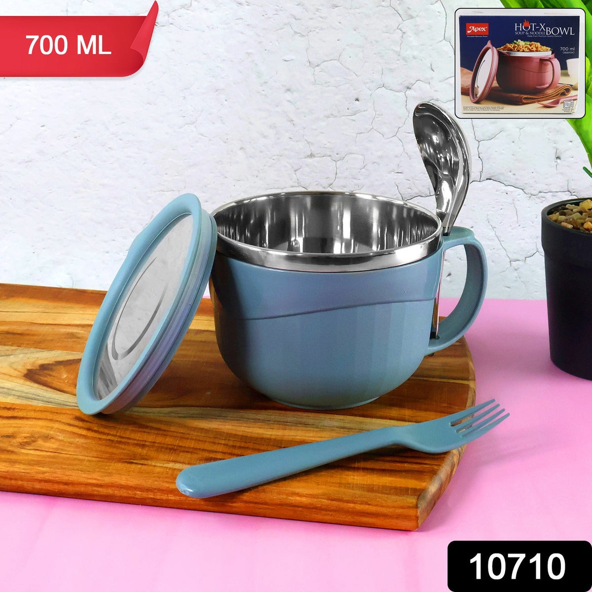 A blue insulated bowl with a lid, a spoon, and a fork on a wooden board, with a 700ml label and product box.