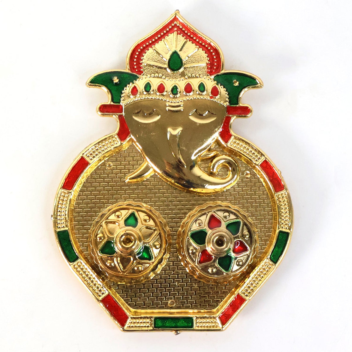 A golden Ganesh pooja thali with two small round containers, accented with red and green enamel details, against a white