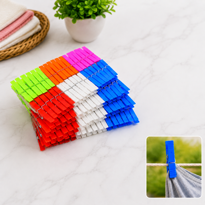 A stack of colorful plastic clothes clips in red, orange, green, blue, white, and pink, with a small inset of a blue clip on