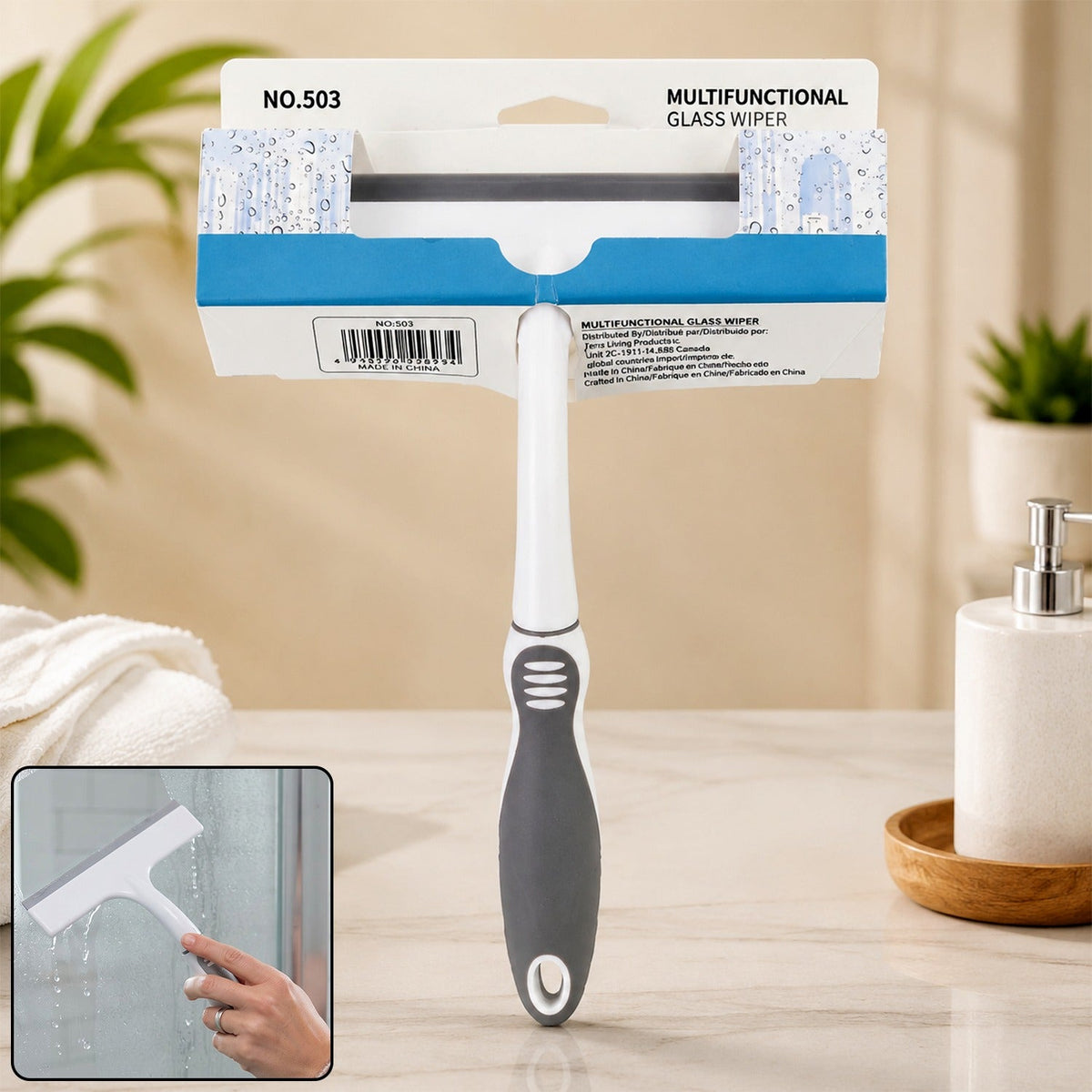 A white and gray glass wiper in its packaging, with an inset showing it in use on a shower door.