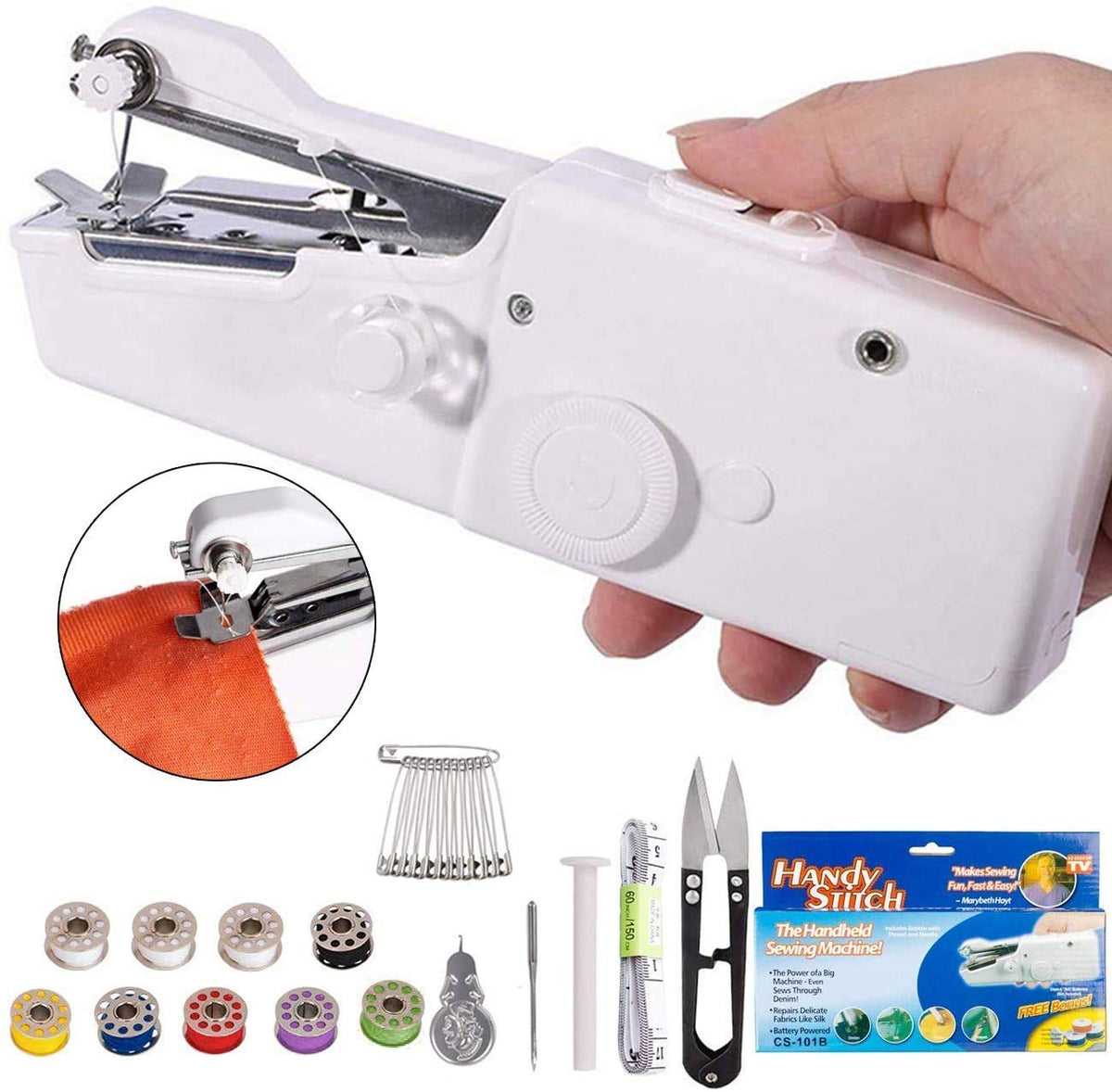 White handheld sewing machine with a fabric swatch, spools of thread, scissors, and various sewing accessories.
