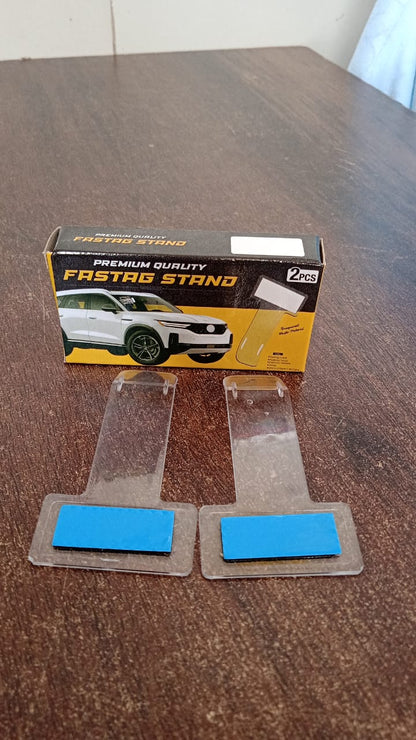 Transparent Fastag cardholder clearly visible on a car's windscreen.