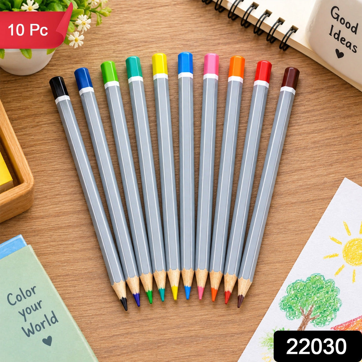 A set of ten gray hexagonal colored pencils with various tips and ends is arranged on a wooden surface with a small plant.
