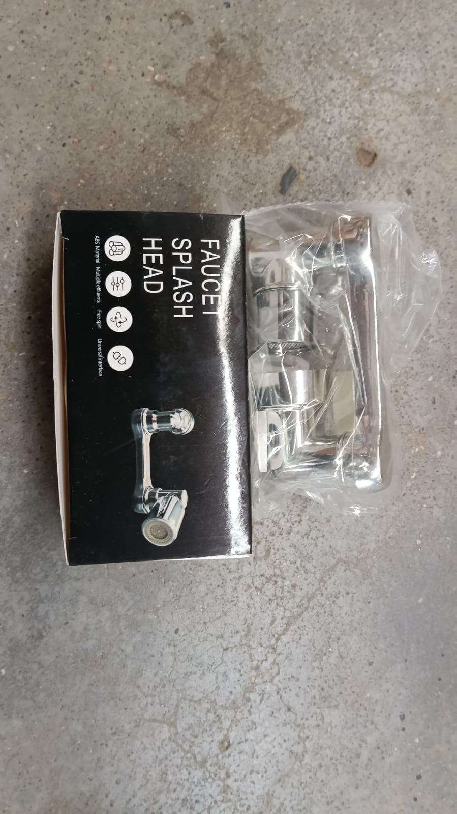 The chrome swivel faucet aerator in its packaging, labeled 'FAUCET SPLASH HEAD', next to the product in plastic.
