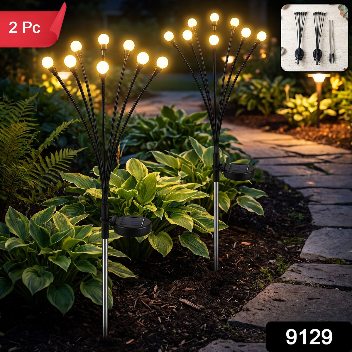 Two solar firefly garden lights with glowing bulbs stand in a garden, with a '2 Pc' label and '9129' code.