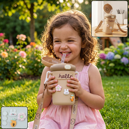 A smiling child holds a tan sipper bottle with a straw and cute animal and flower charms. Small inset shows the bottle and