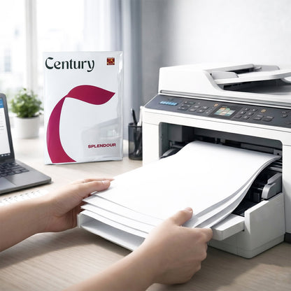 Hands load paper into a white printer next to a Century Splendour paper ream and a laptop.