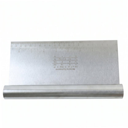 A stainless steel dough scraper with a ruler and measurement equivalents is shown on a white background.