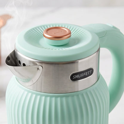 A mint green electric kettle with a ribbed body and a black power cord rests on a white background.