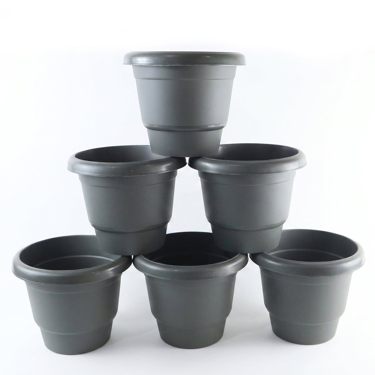 Six gray plastic flower pots, stacked in a pyramid formation, against a plain white background.