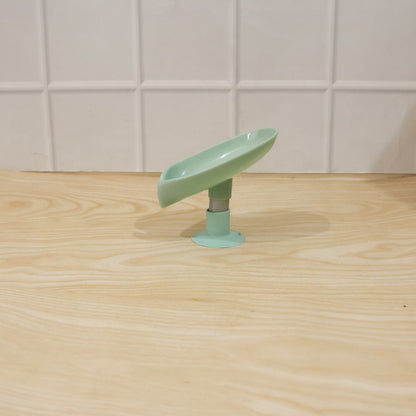 Waterproof plastic soap holder, wall mounted with suction cups in a bathroom environment