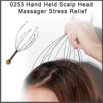 A person's head is being massaged by a metal scalp massager, with another massager shown in the background.
