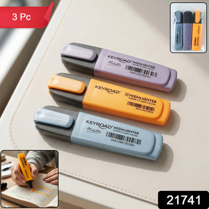Three Keyroad Metallic highlighters in light blue, orange, and purple, with a person highlighting text in the bottom left